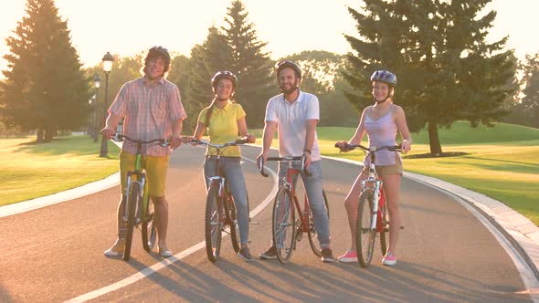 Four Friends on Bicycles on the Road