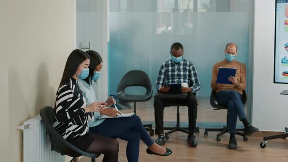 Office Worker Inviting Candidate to Enter Job Interview Meeting