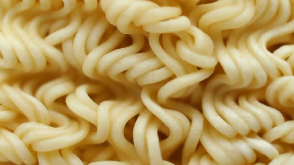 Instant Noodles Close Up. Front of the Camera Rotates Plate with Noodles