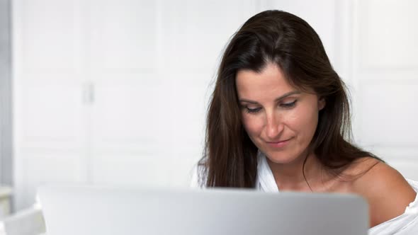 Medium Closeup Portrait Smiling Pretty Woman Enjoying Weekend and Chatting Using Laptop