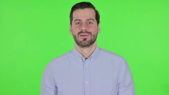 Portrait of Man Shaking Head As Yes Sign Green Screen