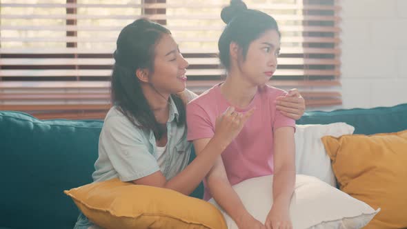 Young Lesbian lgbtq Asian women couple angry conflict together at home.