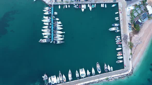 Top down view of yachts in the marina. Sailboats and regular Boats moured