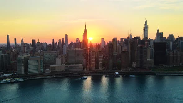 Unique Manhattanhenge 2020 aerial shoot, revealing the golden light of the streets of Midtown New Yo