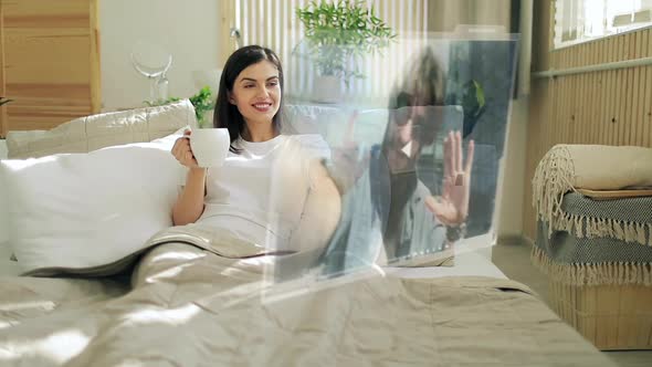 Woman Receives Video Call on Hologram Screen