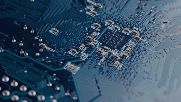 Computer Electronic Circuit Board with Radial Conductor Tracks and SMD Capacitors Rotating Macro