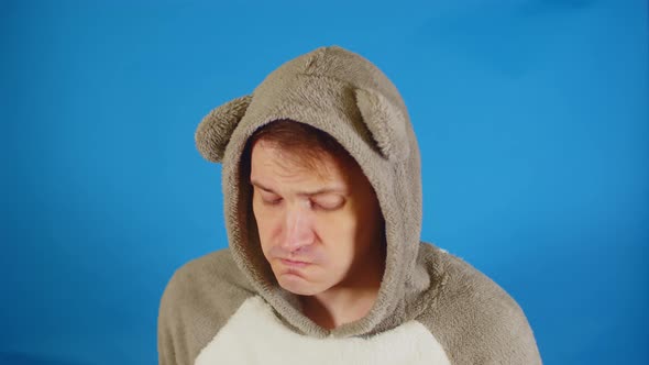 Nice Man in Hoodie with Ears on Blue Background