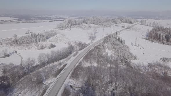 White frozen and snowy winter landscape from bird eye