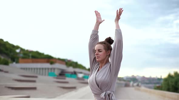 Middle Shot Portrait of Meditative Caucasian Young Woman Practicing Yoga Performing Namaste Pose