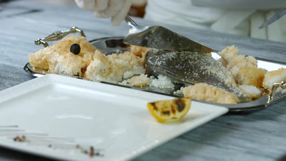 Spatula Cuts Skin of Fish.