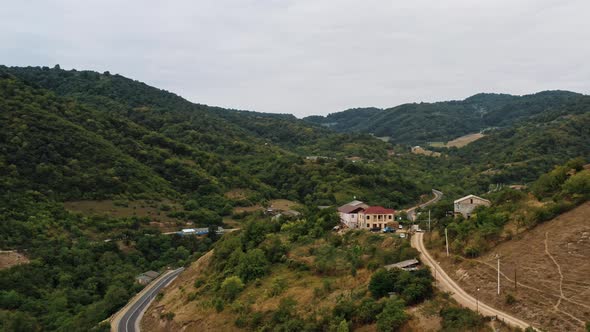 Aerial Drone Flying Over Houses on the Hills in Armenia