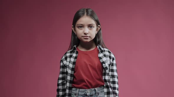 Portrait of Little Girl Gives a Thumbs Up Smiling Surprised and Happy Emotions