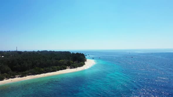 Aerial drone seascape of idyllic bay beach trip by shallow water and white sandy background of a day