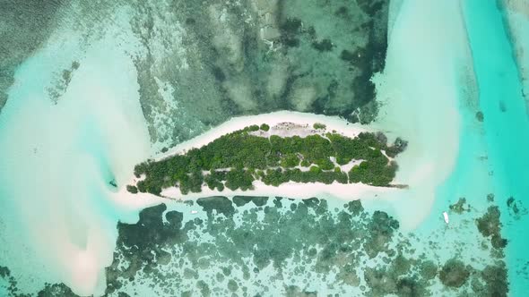 Aerial Drone Video of an Abandoned Island with a Sandbar in Maldives