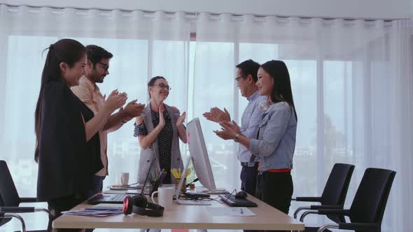 Successful Business People Celebrating Project Success at Office