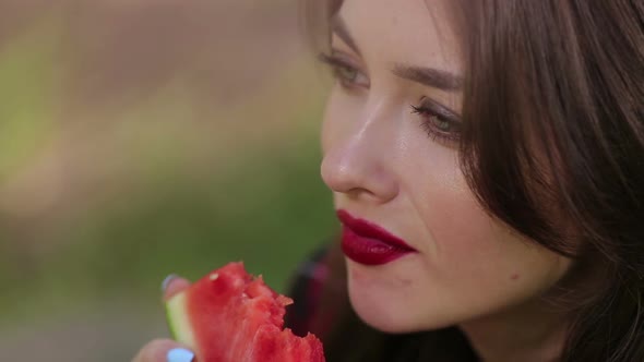 Pretty Woman Seductively Eating Watermelon