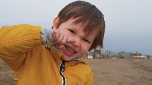 A Portrait of Cute Young Boy on the Beach