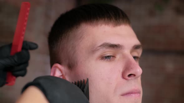 Male Haircut with Electric Razor. Close Up of Hair Trimmer Hairstyle. Professional Hairdresser