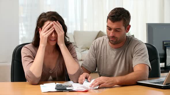 Couple calculating their bills