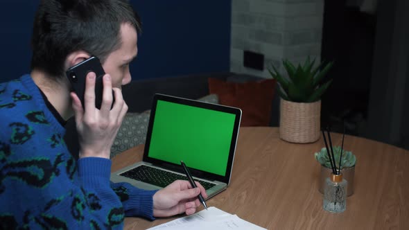 Man Talking Phone Work Papers Looking Laptop Green Screen Mockup Display Chroma Key