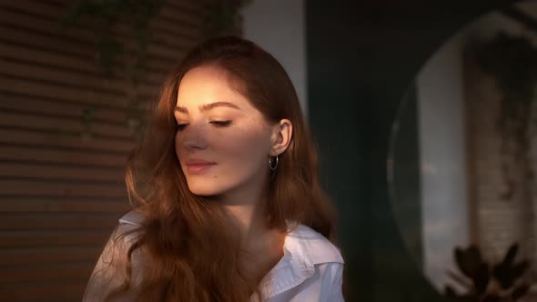 Portrait Of Beautiful Red-Haired Girl.