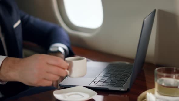 Relaxed Businessman Working Computer on Trip