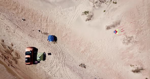 Top Down View of Solo Camping on Tropical Sandy Beach