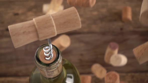 Wine corks fall on an old wooden board