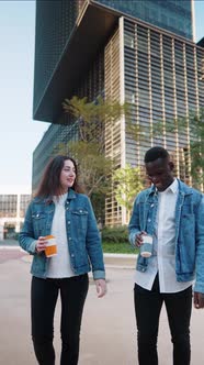 Multiracial Friends with Coffee Walking in City