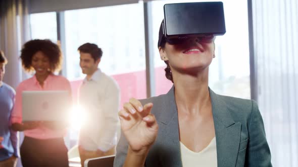 Businesswoman using the virtual reality headset