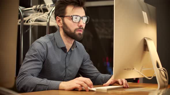 Man Working In Modern Office At Sunrise On Laptop. Creative Man With Computer Overtime Working.