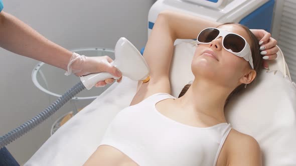 Young Woman on Laser Epilation Procedure