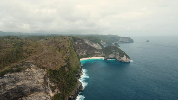 Rocky Cliff with Beach in the Sea. Karang Dawa.