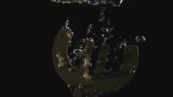 Golden Euro Symbol Falls In Water