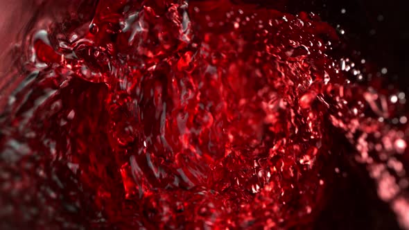 Super Slow Motion Abstract Shot of Red Wine Pouring in Glass Bottle at 1000 Fps