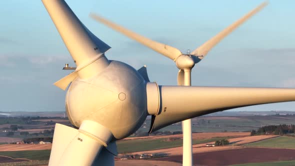 Wind Turbines at Sunset Generating Renewable Energy