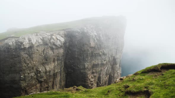 Beautiful View of Foggy Traelanipan Slave Mountain in Vagar Faroe Islands