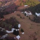Aerial Drone View of Forest and Meadows in Spring in a Mountain Wooded Village - VideoHive Item for Sale