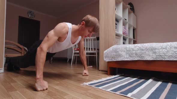 A Man Sport Exercising At Home