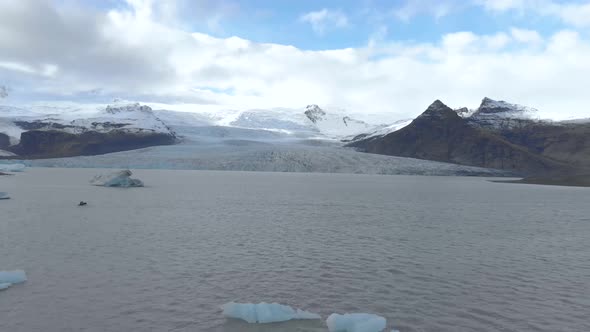 Aerial Establishing Shot of a Glacier and Lagoon.