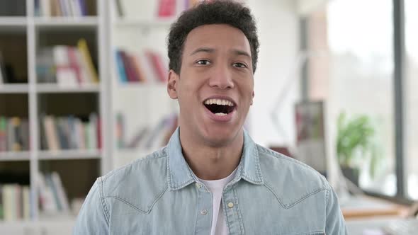 Yes, Young African American Man Shaking Head in Approval 