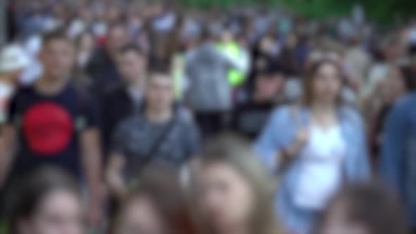 Silhouettes of People Walking in a Crowd