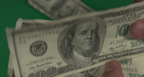 Dollars. American Money Close-up on a Green Background Hromakey . 100 Dollar Bills. One Hundred