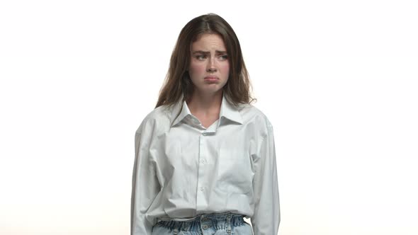 Video of Silly Attractive Girl in White Shirt Looking Upset and Distressed Sighing and Pouting