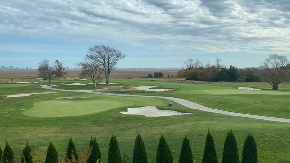 Landscape of Green Golf Course with Trees and Lakes Timelapse