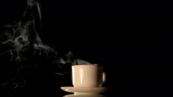 Steaming White Coffee Cup on Black Background