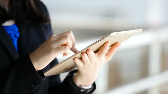 Girl using tablet shopping online during sale