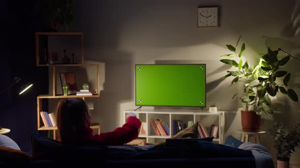 Woman Watching Television with Chroma Green Screen