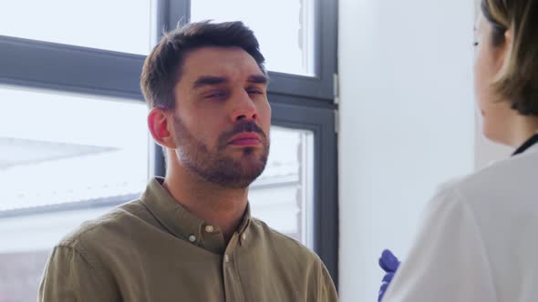 Doctor Checking Lymph Nodes of Patient at Hospital