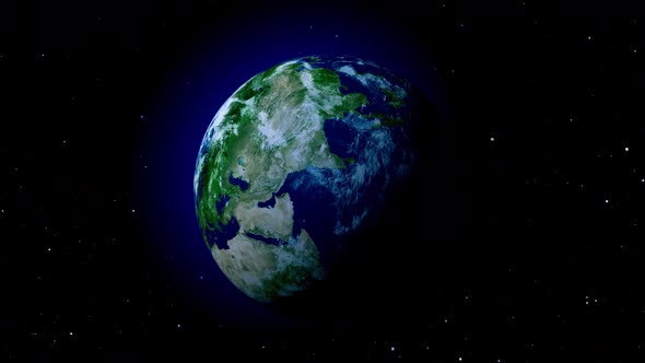Green earth with blue atmosphere in space with stars.